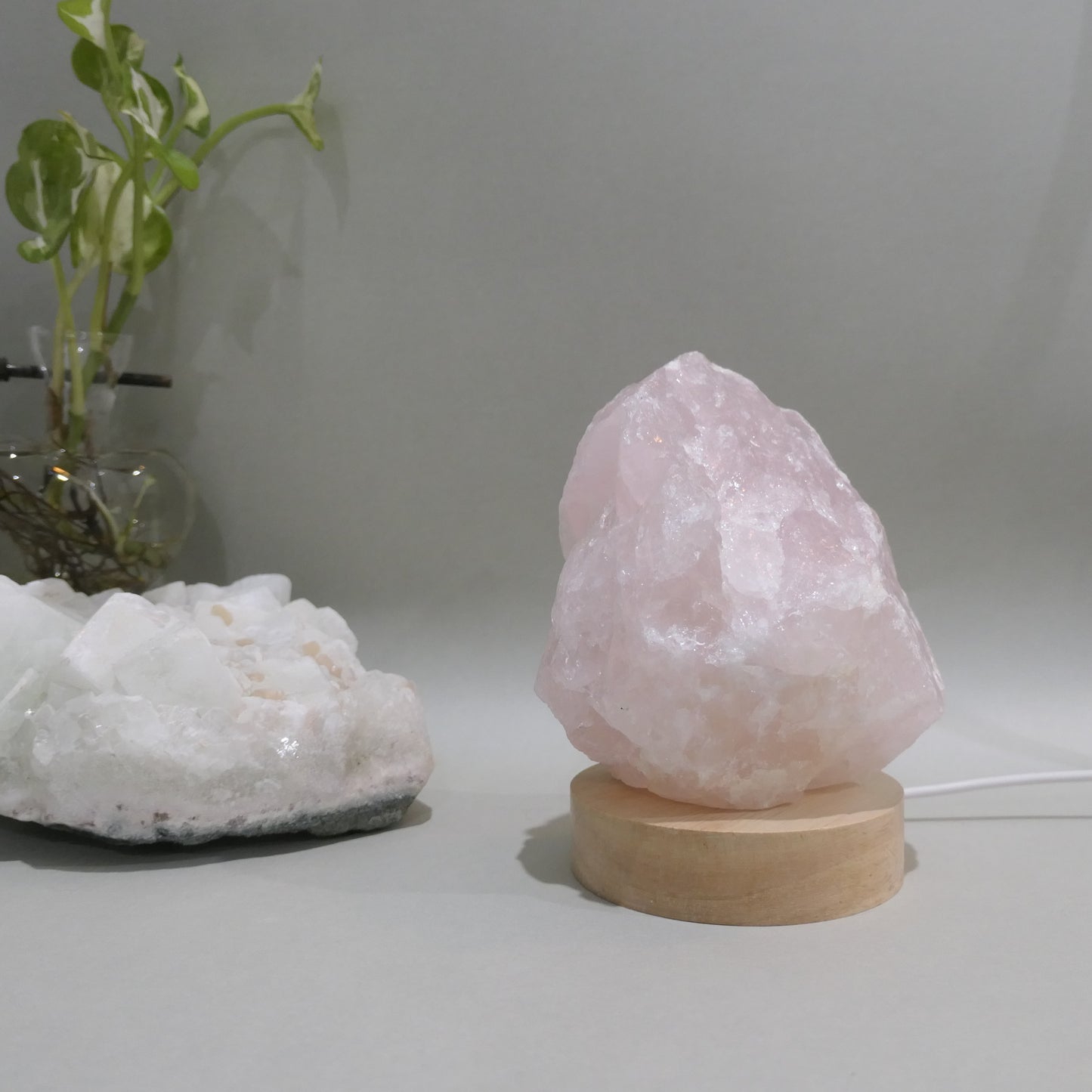 1kg Rose Quratz Cut base sitting on 8mm wooden LED white light base