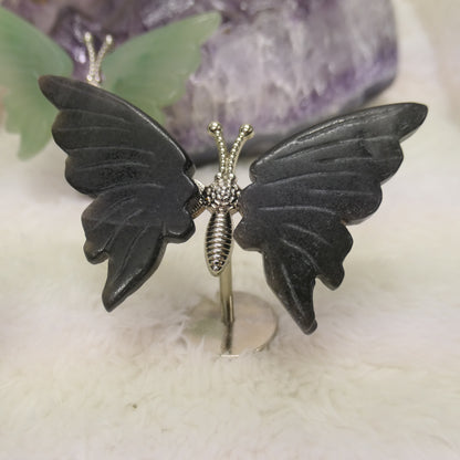 Butterfly on silver metal stand