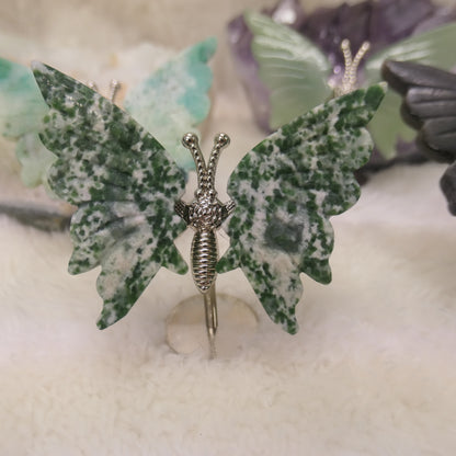 Butterfly on silver metal stand