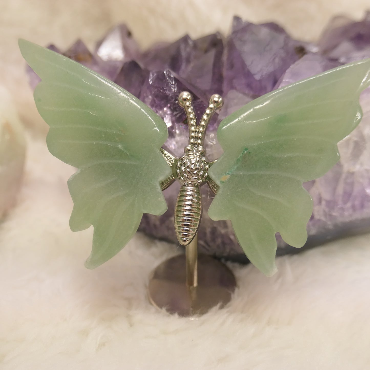 Butterfly on silver metal stand
